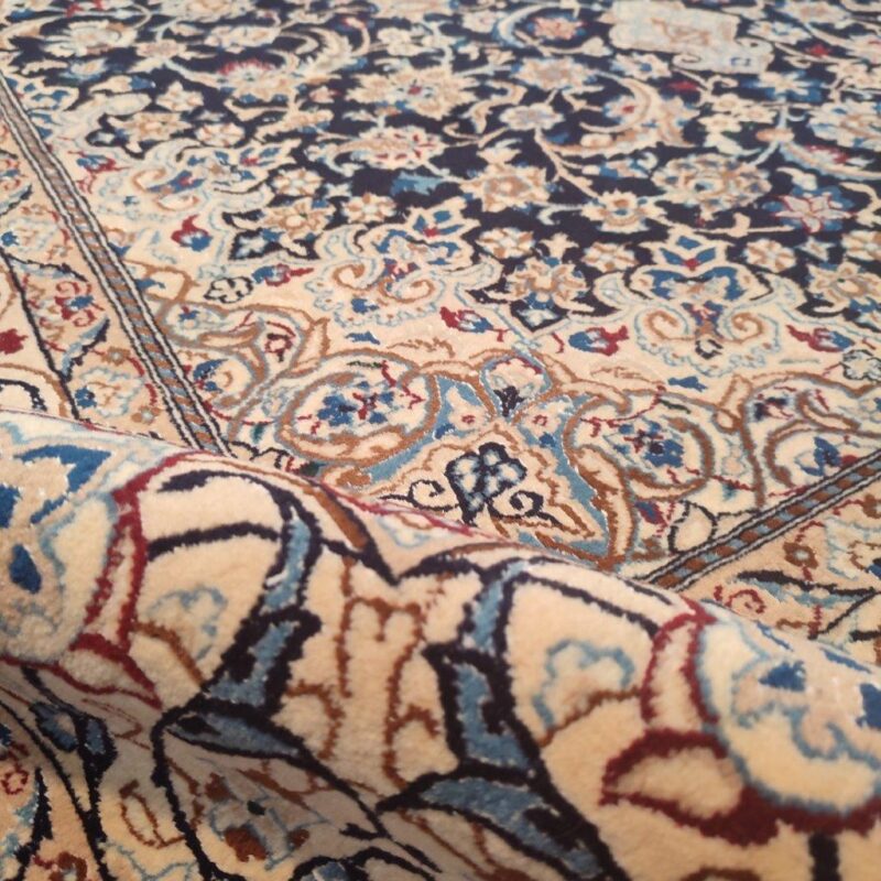 A pair of four-and-a-half-meter old hand-woven Nain model carpets